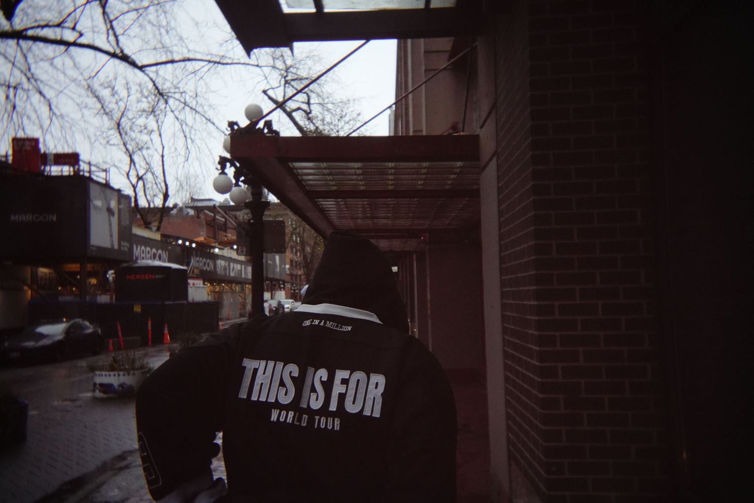 Dark architectural detail with text visible on building exterior.