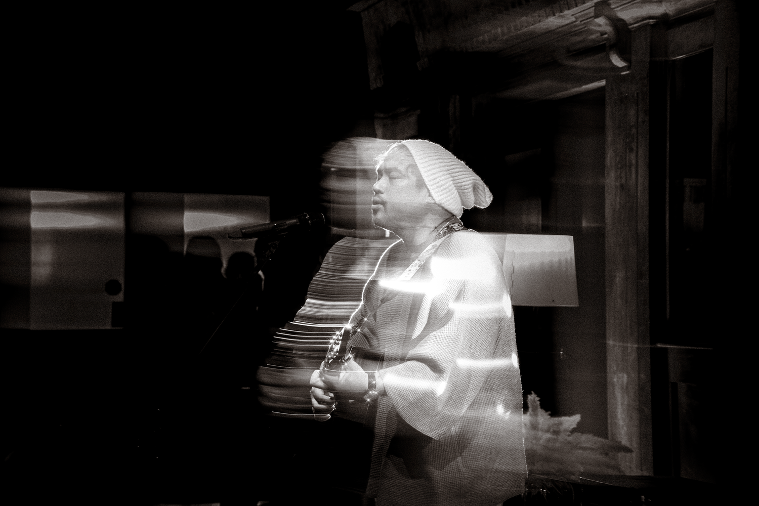 Abstract black and white long exposure photograph creating streaks of light and motion.