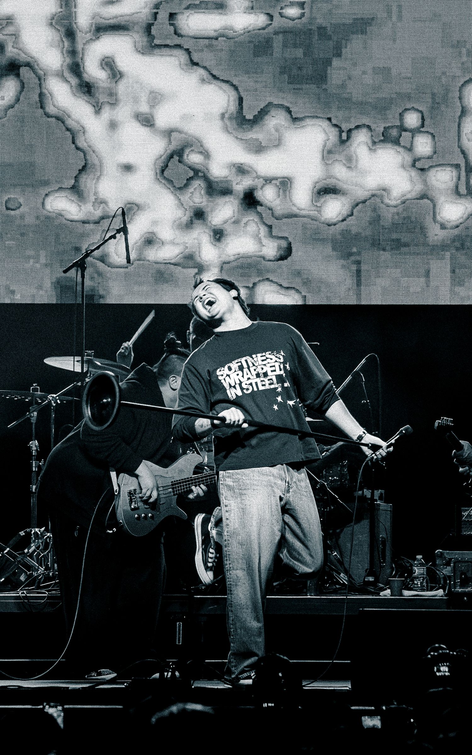 Black and white concert performance sequence showing dramatic stage movements.