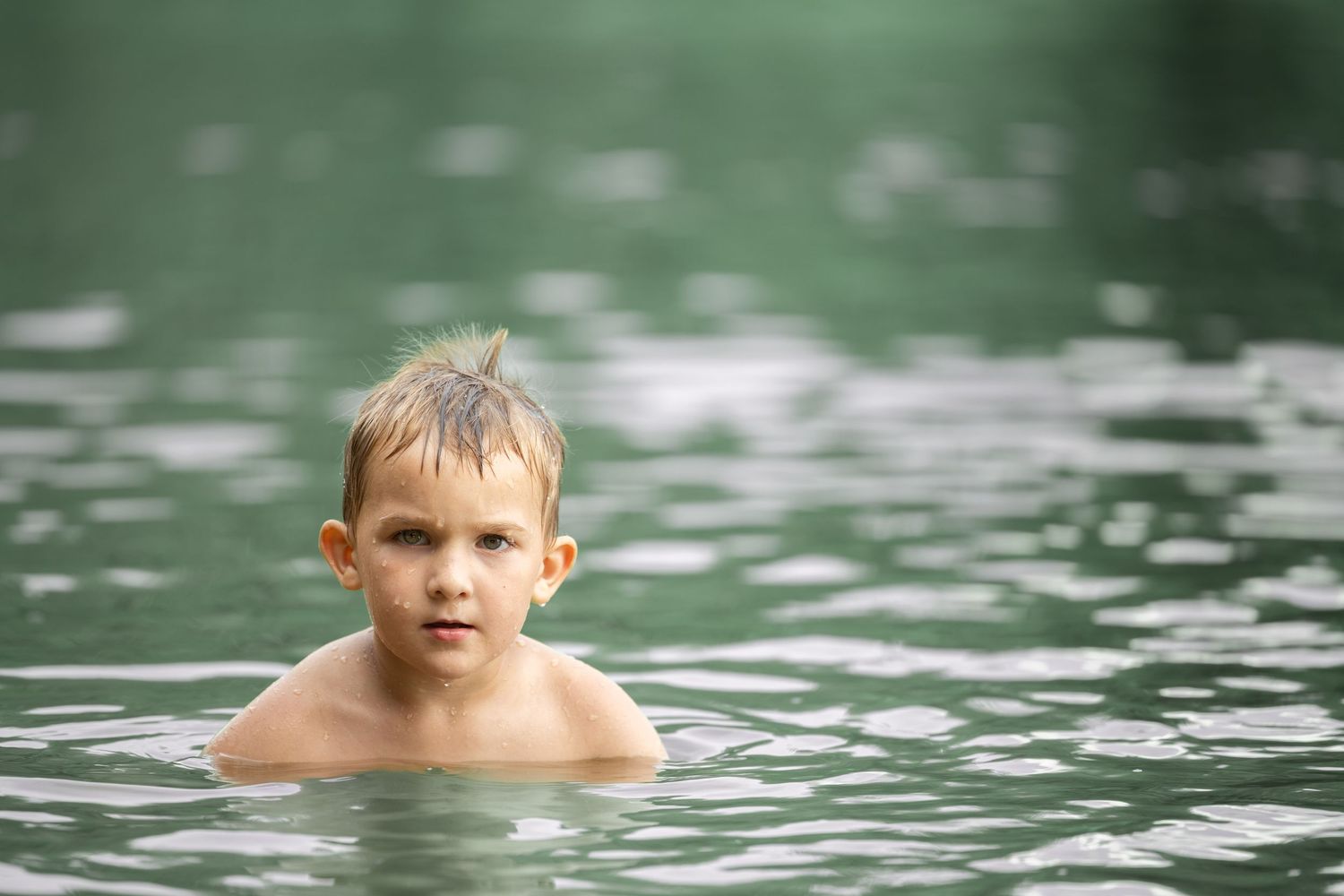 A small child in the water.