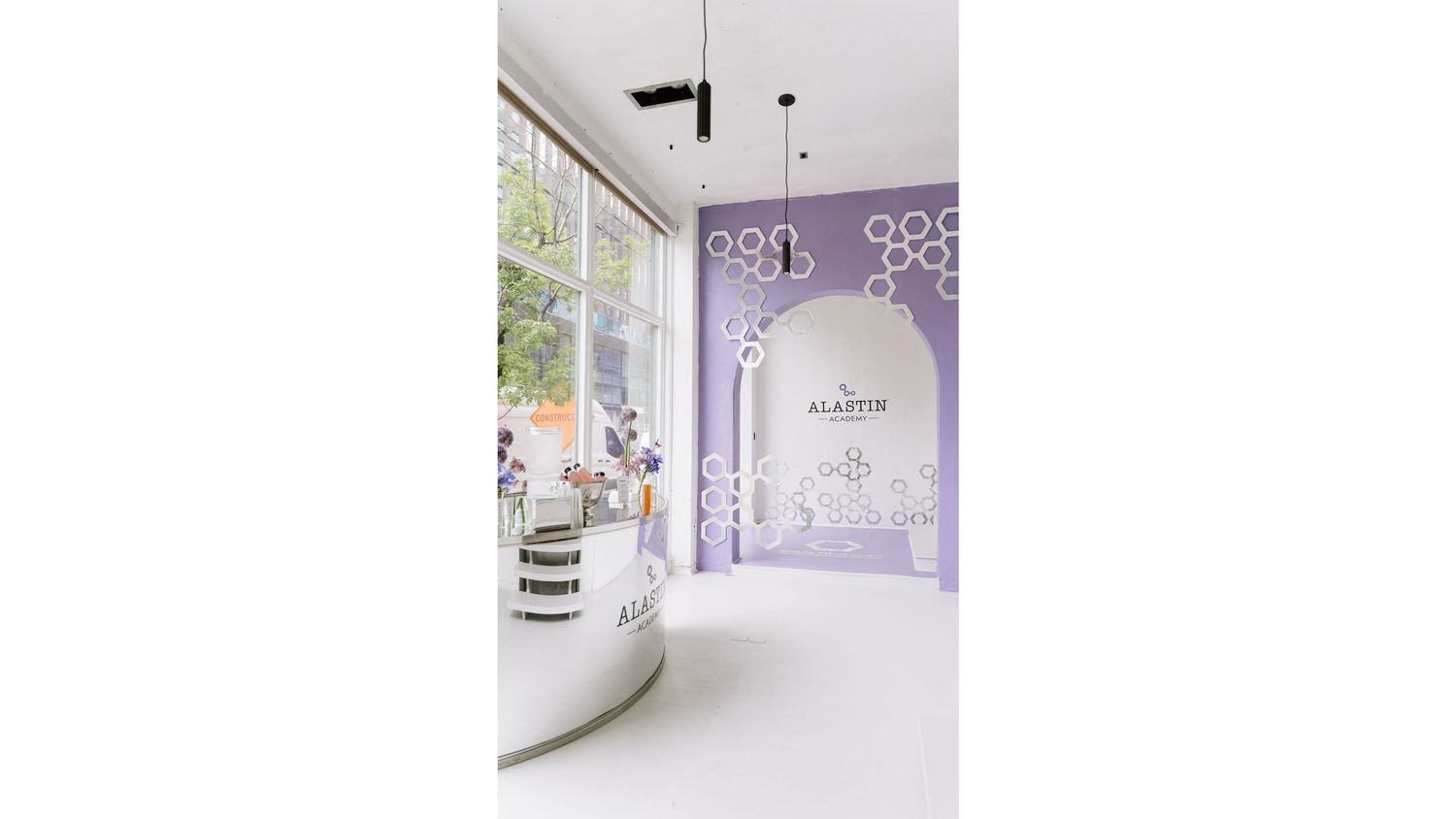 Interior design elements featuring purple walls and modern lighting fixtures.