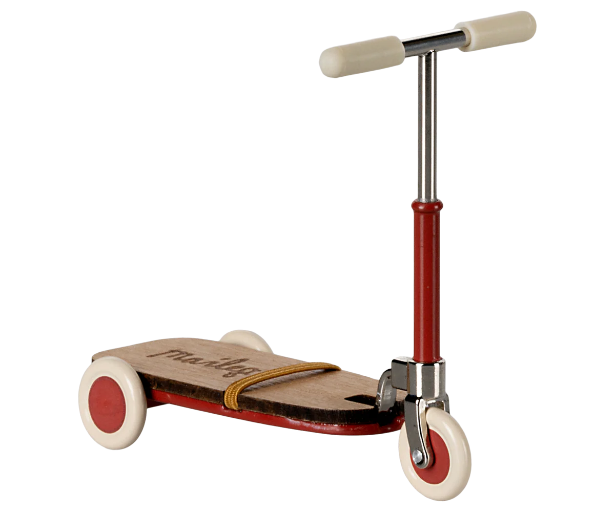 Vintage red and silver kick scooter with wooden deck and white handle grips for children.