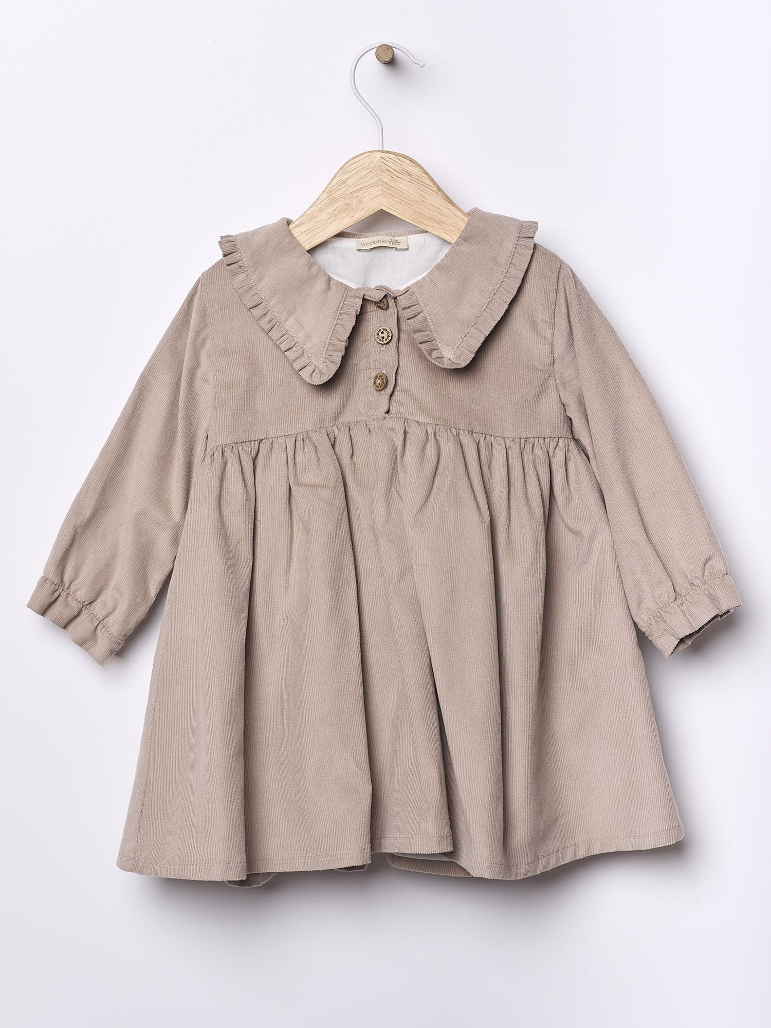 Beige linen baby dress or top with Peter Pan collar and puff sleeves shown in multiple views.