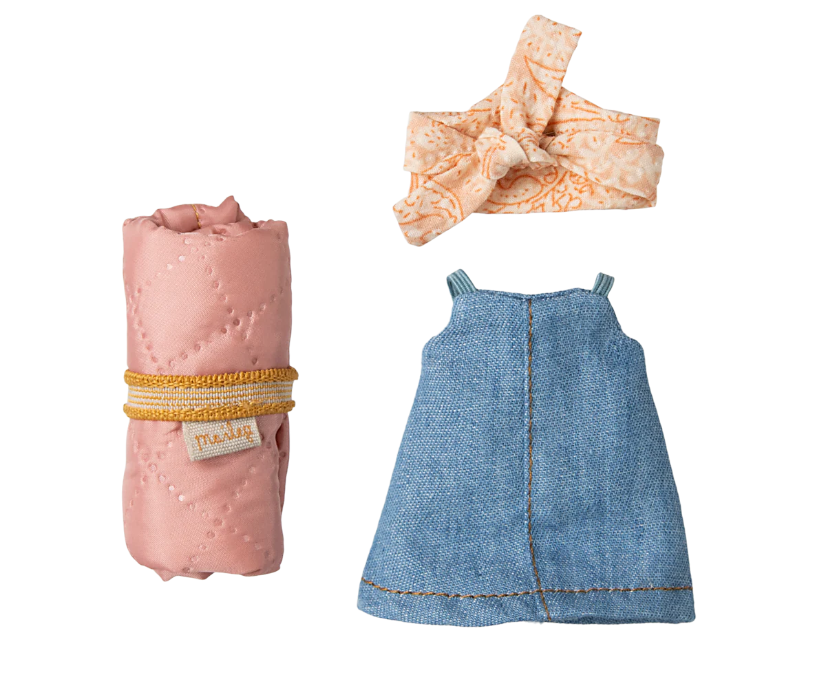 Pink and denim blue baby clothes displayed in a row showing different styles and sizes.