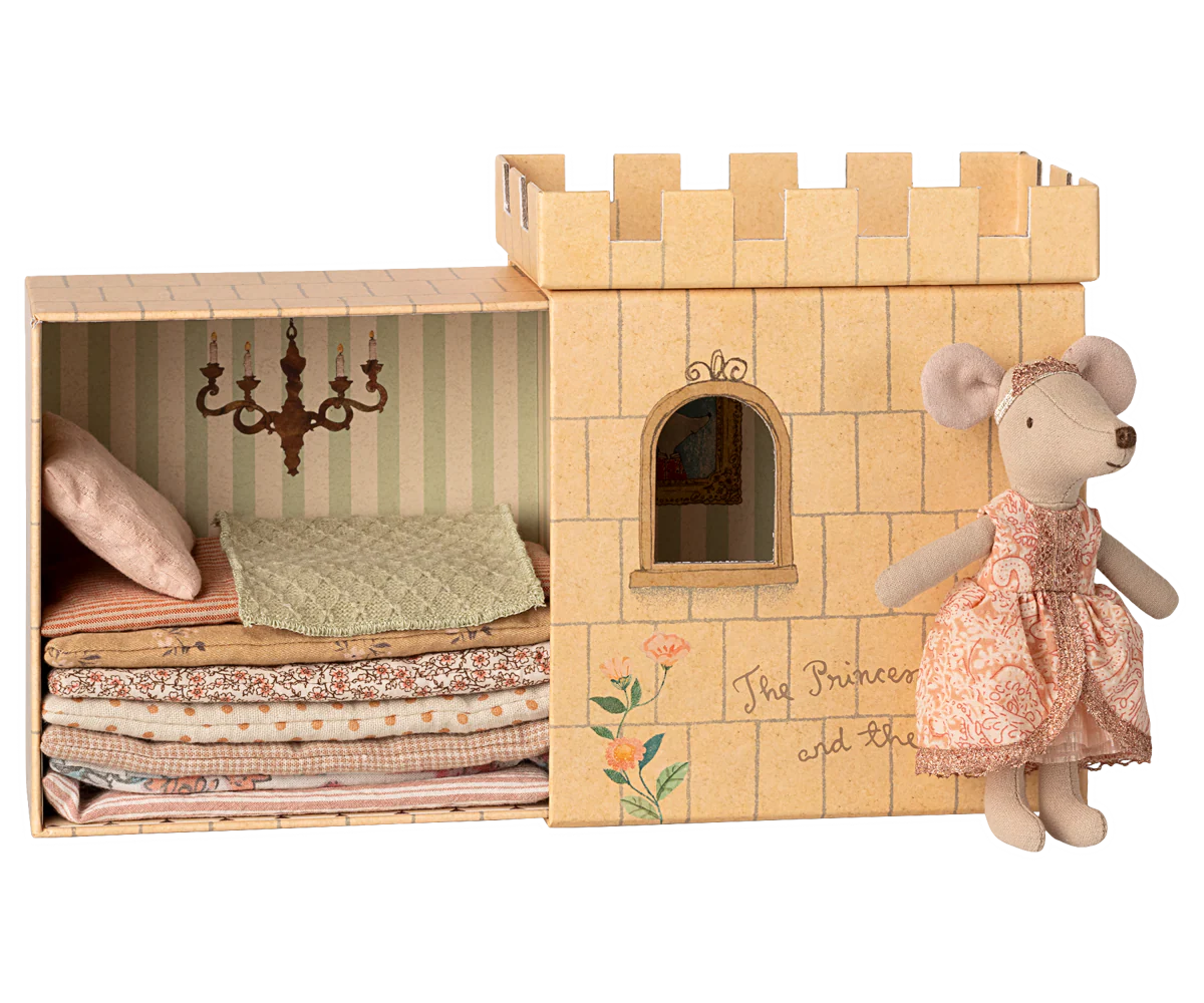 A series of cozy nursery decor items including plush toys and soft bedding in muted pastel colors.