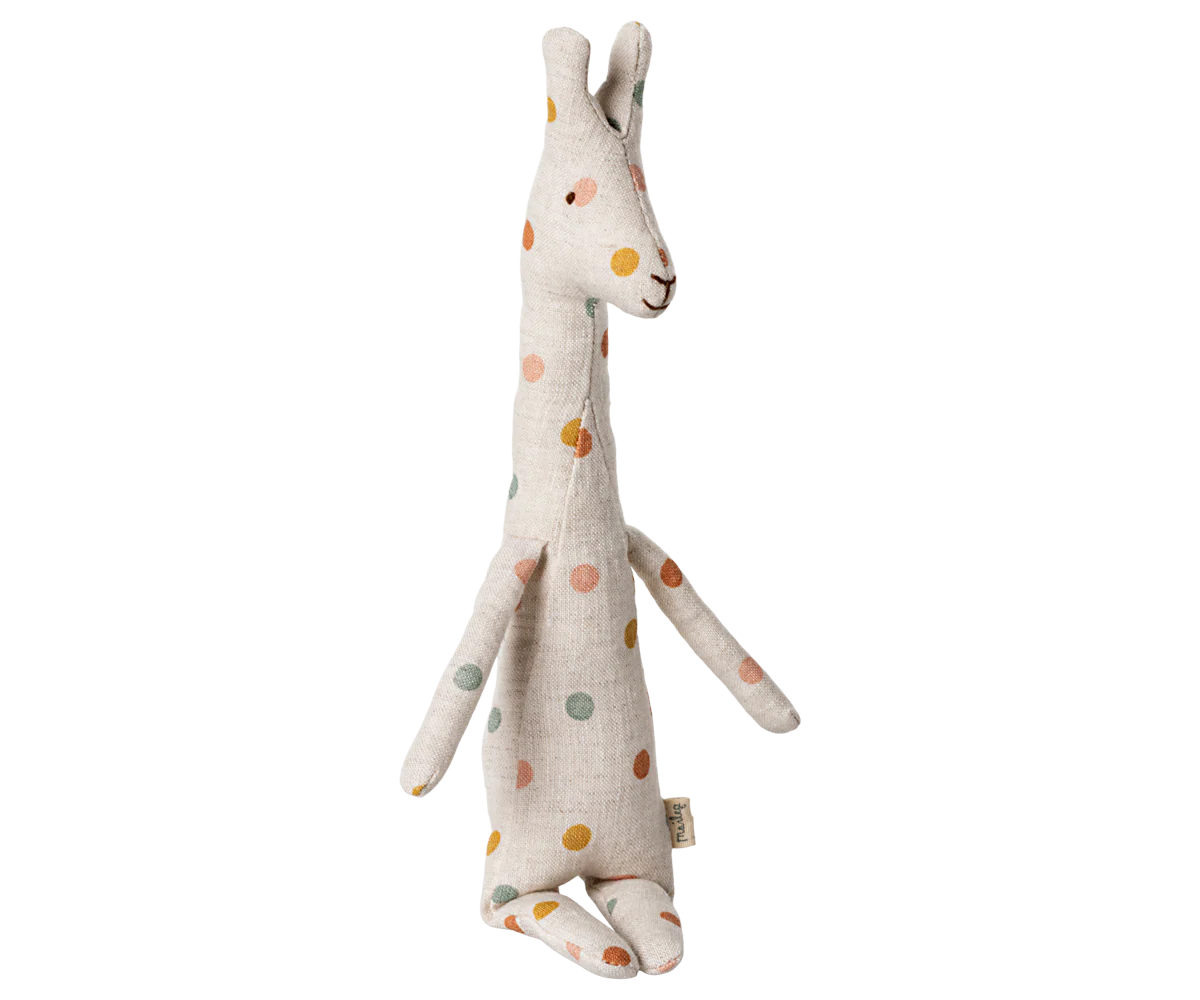 A white stuffed bunny toy with polka dot pattern shown from multiple angles on white background.