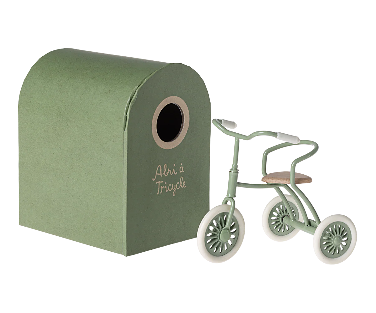 Vintage-style mint green metal toy house and tricycle set from Maileg toys against white background.
