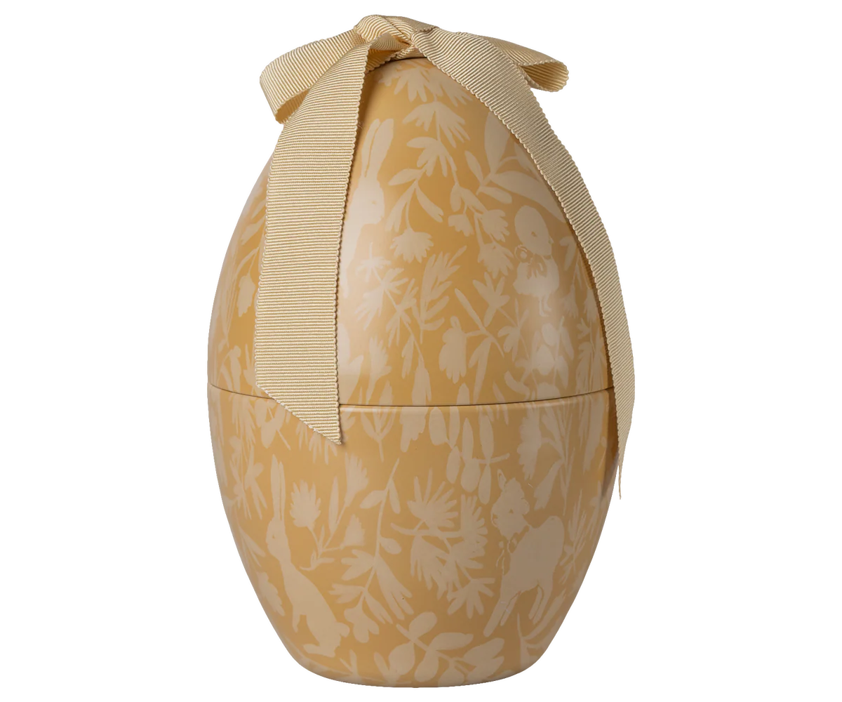 A set of four cream-colored ceramic spherical containers with delicate floral patterns shown from different angles.