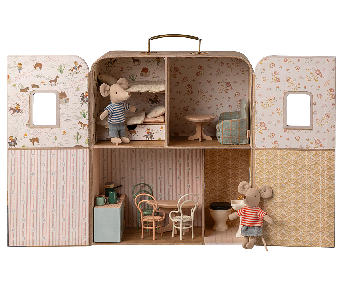 Vintage dollhouse with miniature furniture and decor displayed in multiple rooms with floral wallpaper patterns.