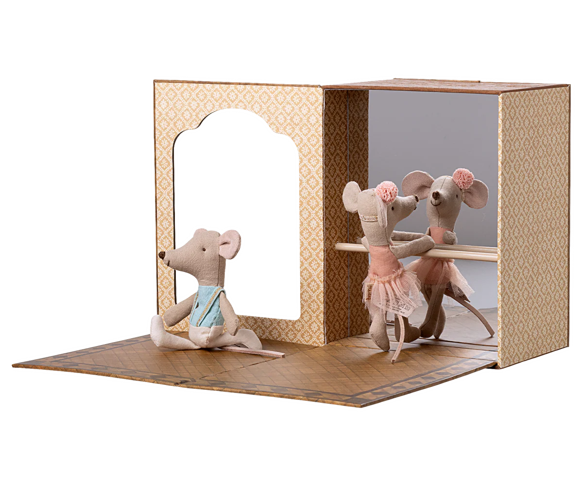 A set of miniature mice figurines arranged in a cardboard dollhouse display with multiple rooms and scenes.