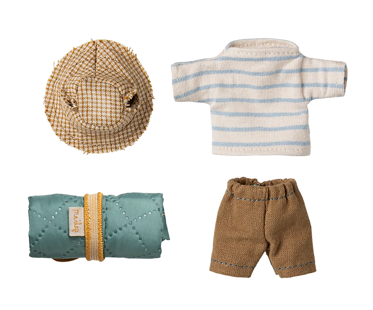 A collection of baby clothing and accessories in neutral tones featuring plaid hats, striped shirts, and brown shorts.