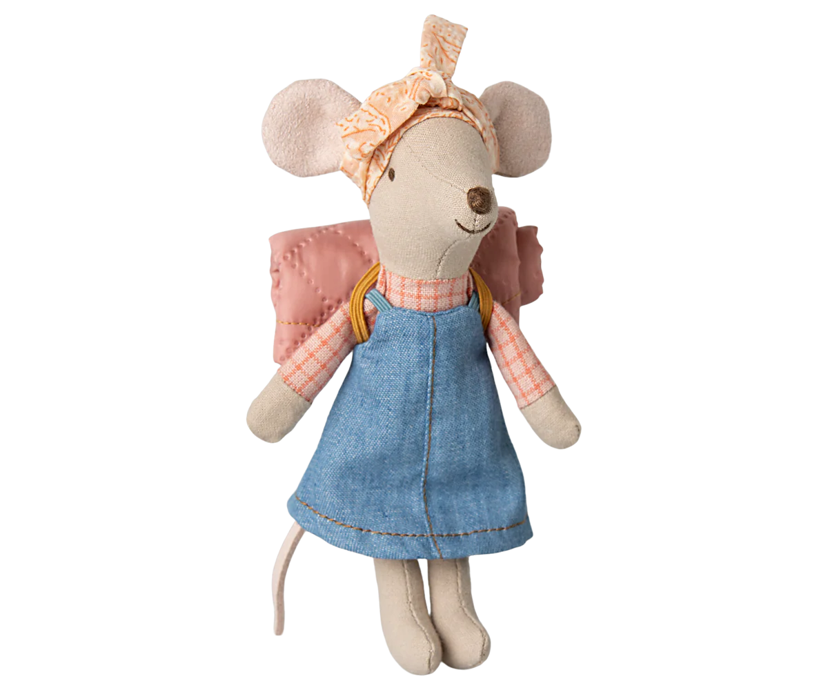 Cute plush mouse toy wearing denim dress, pink jacket and peach bow accessory standing against white background.