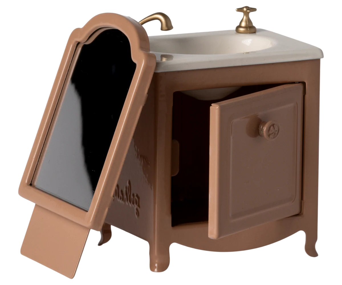 Brown plastic mailbox with flip-up flag and curved top design shown from multiple angles against white background.