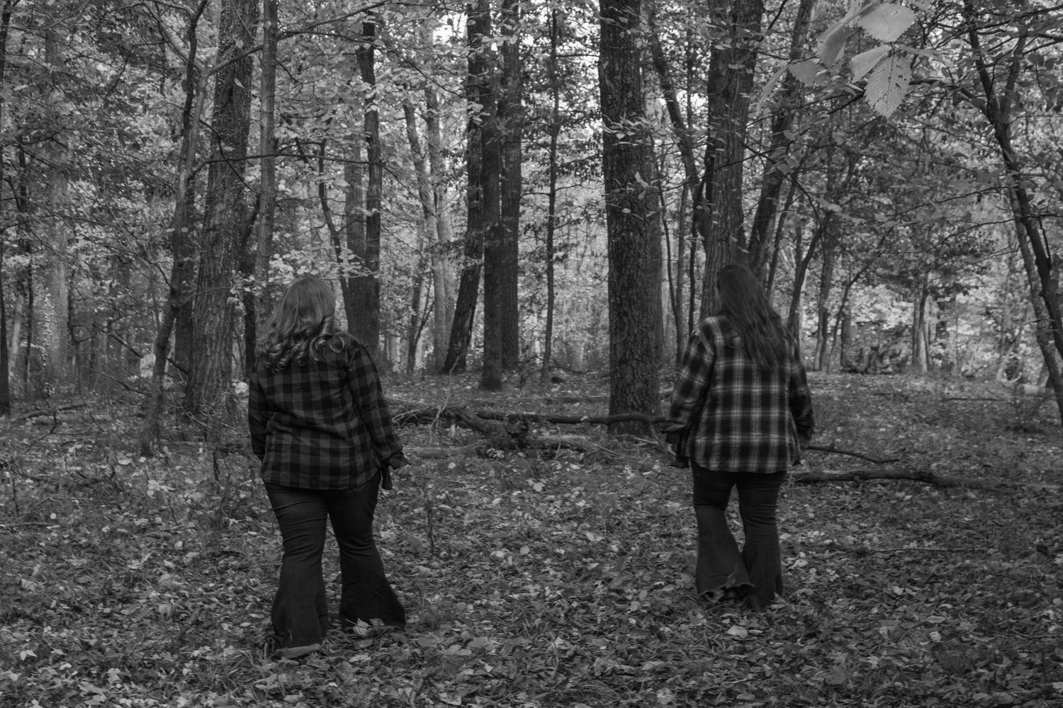 Mother and daughter walking in the woods