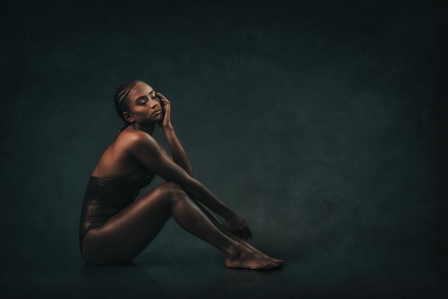 Minimalist portrait series with flowing poses against dark backdrop.
