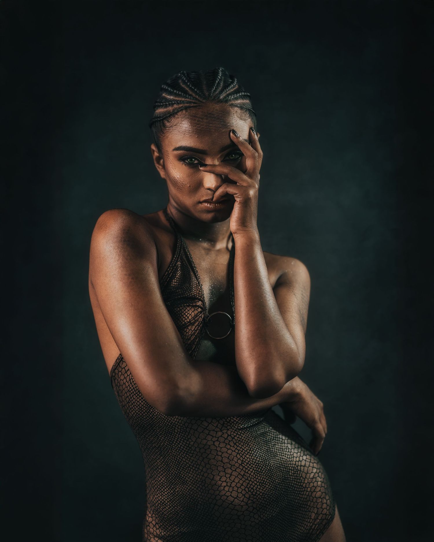 Moody fashion portrait series with textured outfit against dark background.