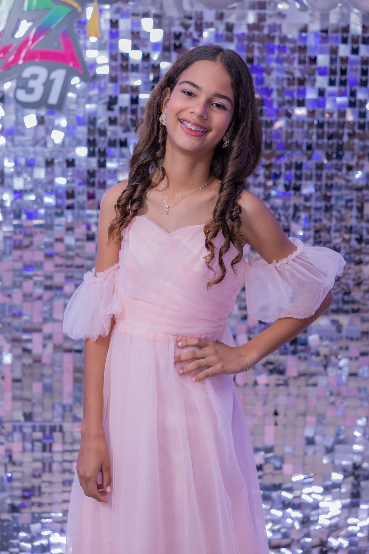 Young girl in pink off-shoulder dress poses against sparkly purple mosaic background in a photo collage.