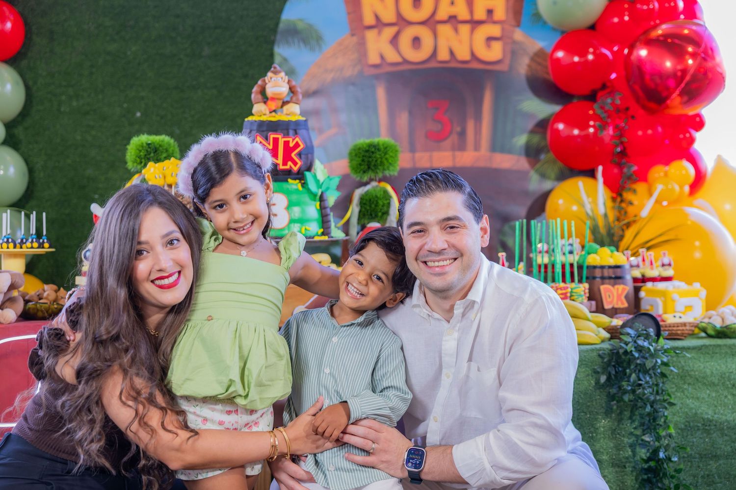 Colorful party scene with balloon decorations and festive background displays.