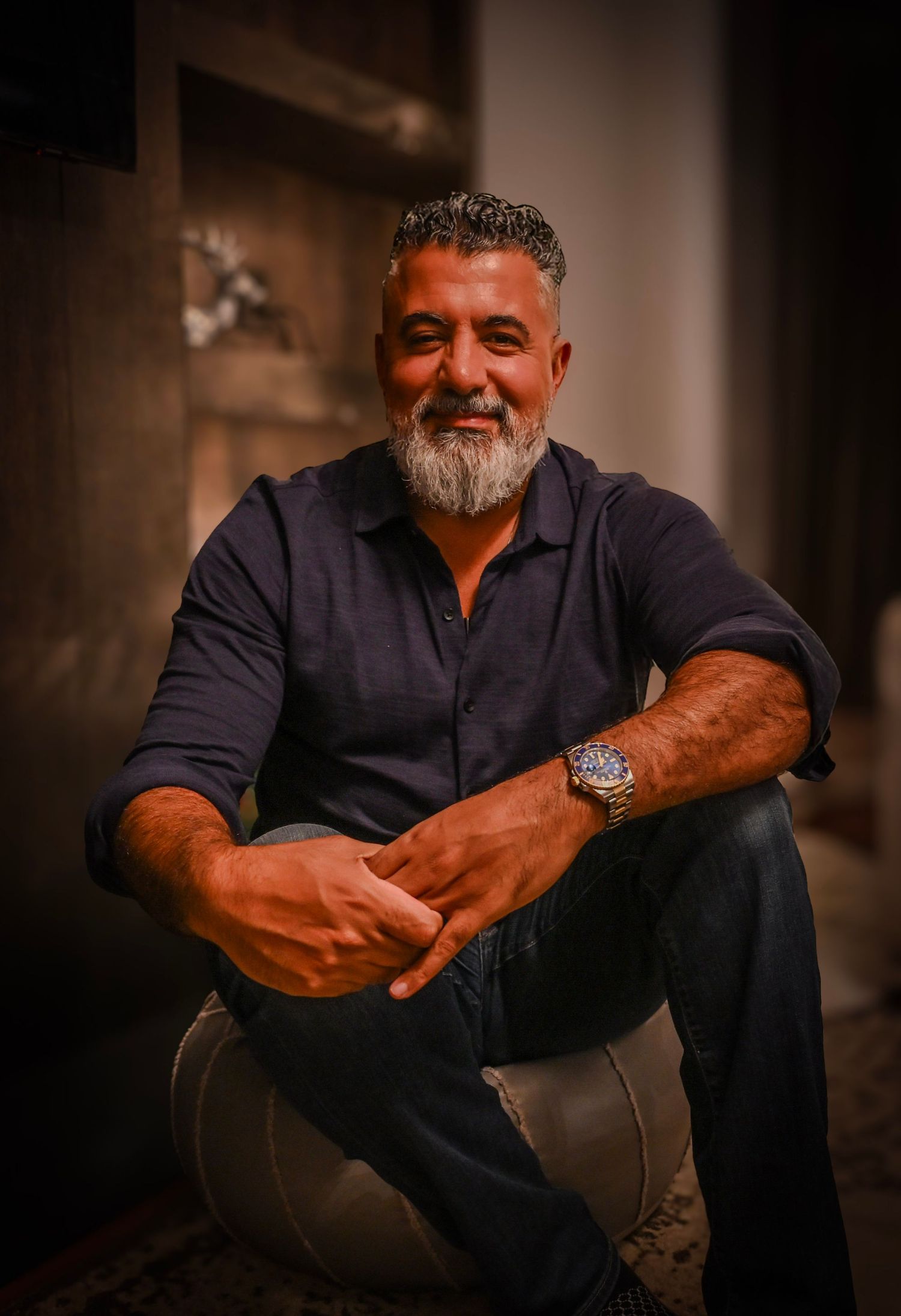 Series of casual portraits showing man in dark shirt against moody background.
