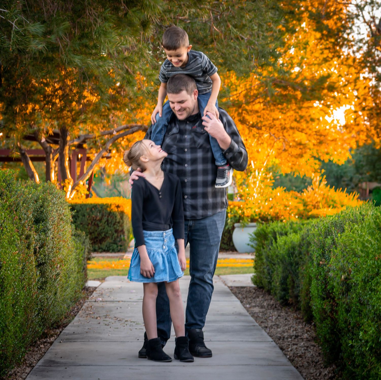 A playful photo sequence of a couple interacting on a garden pathway.
