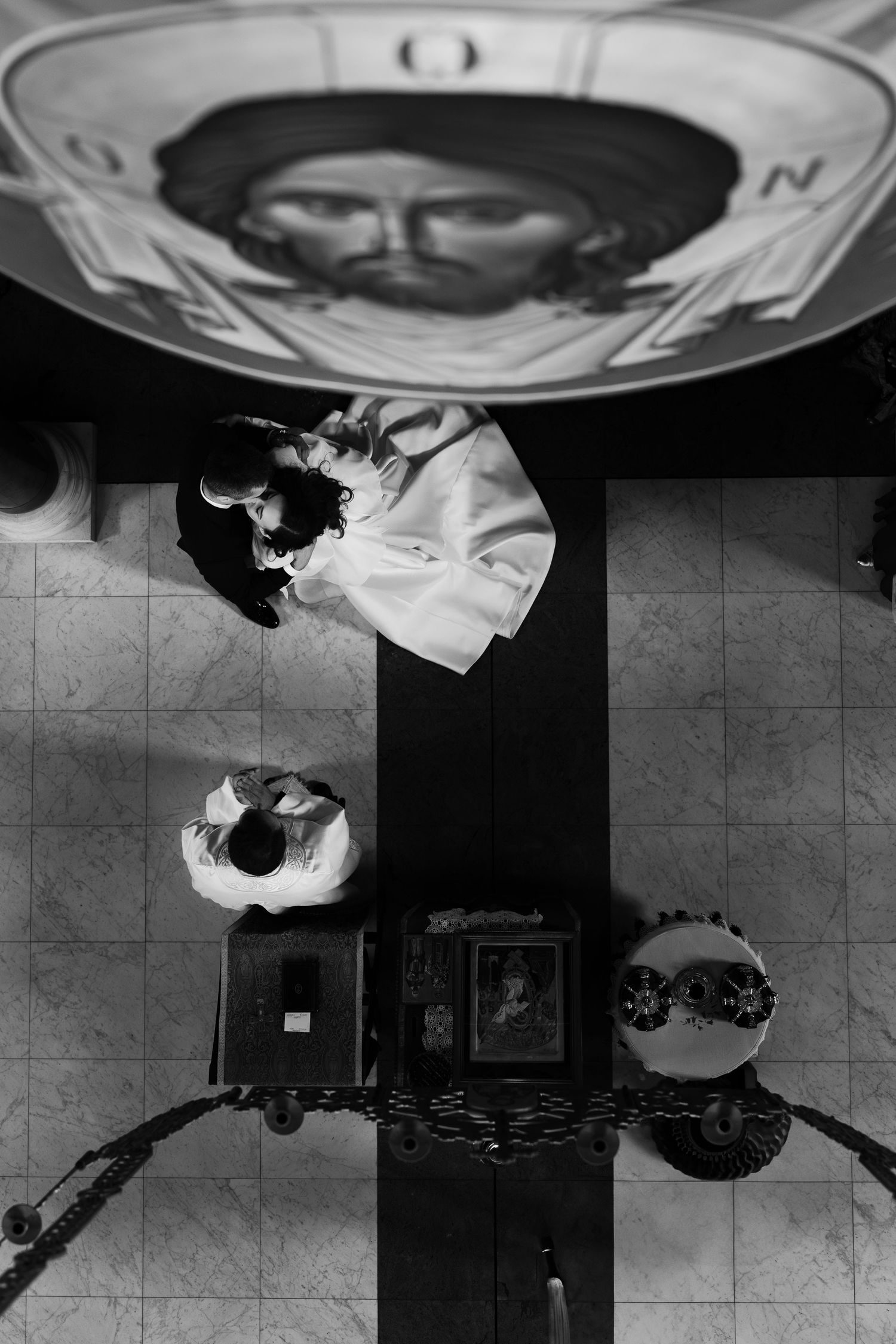 Black and white artistic overhead shots of wedding guests in formal attire.