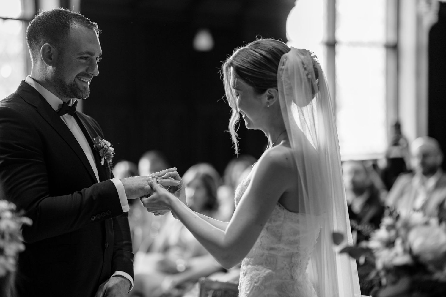 Black and white candid moments from a wedding ceremony.