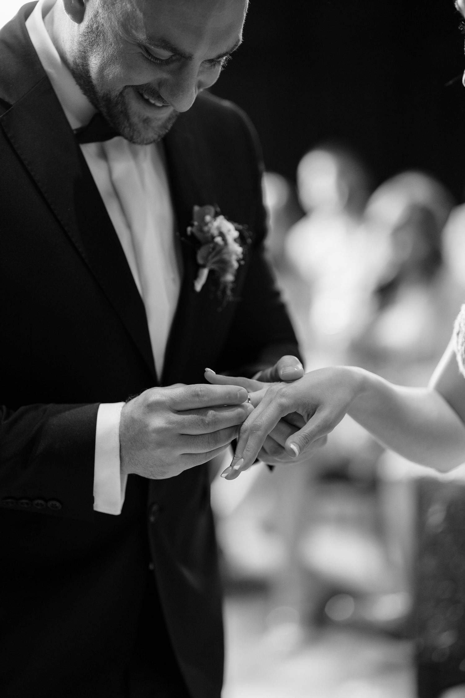 Close-up shots of wedding ring exchange during ceremony.