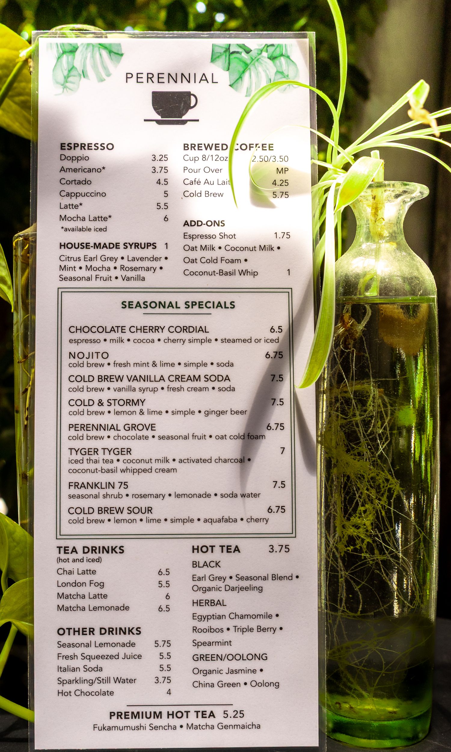 Perennial cafe full menu board with espresso drinks, brewed coffee, seasonal specials, tea, and hot tea options.