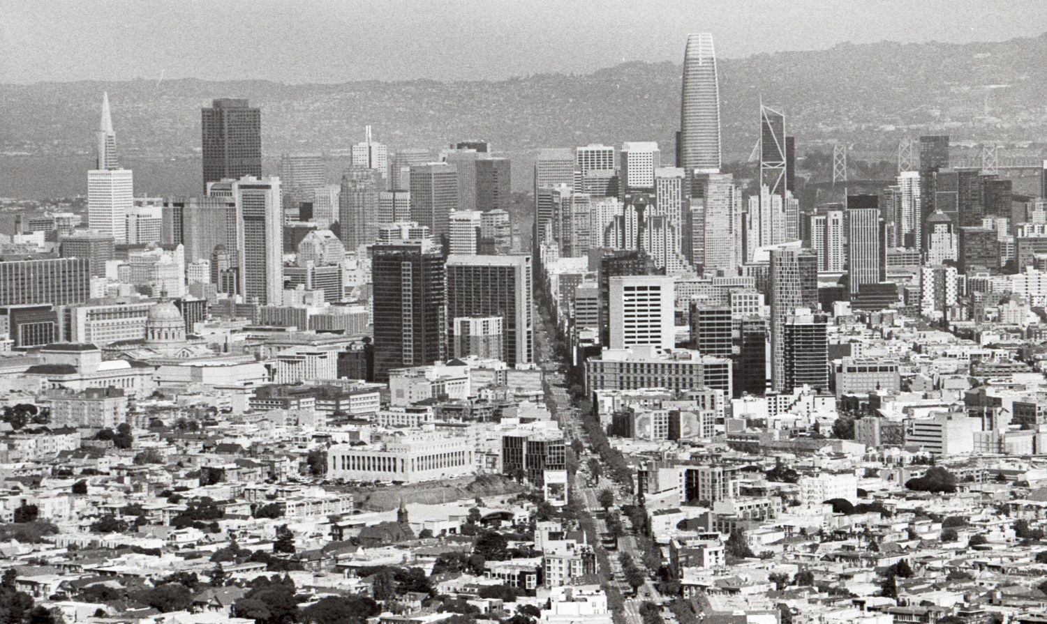 Aerial black and white photo of the San Francisco skyline with the Transamerica Pyramid visible.