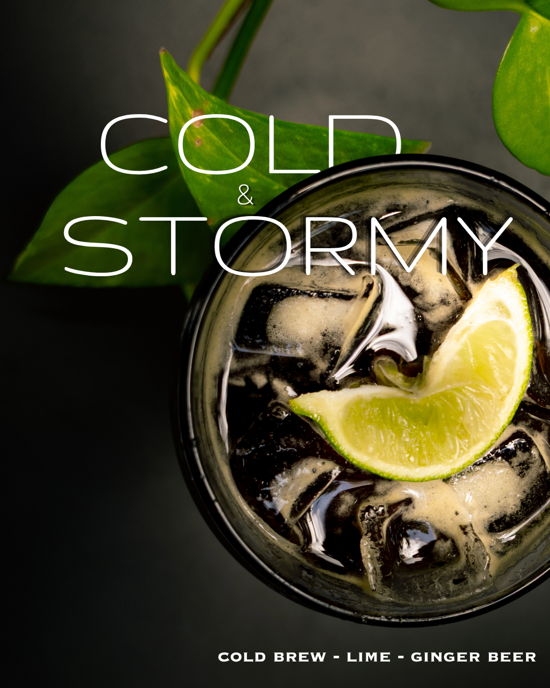 Cold and Stormy iced coffee drink with lime wedge, cold brew, lime, and ginger beer on dark background.