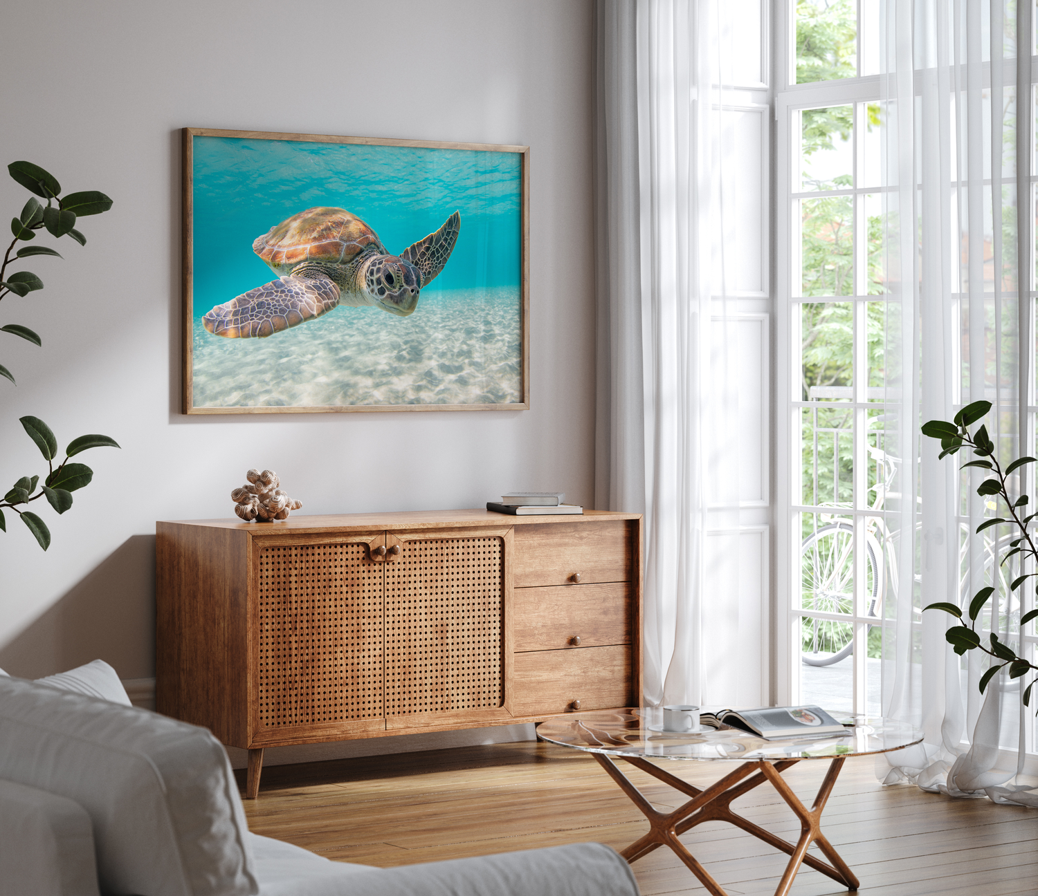Modern living room interior with sea turtle wall art and rattan sideboard.