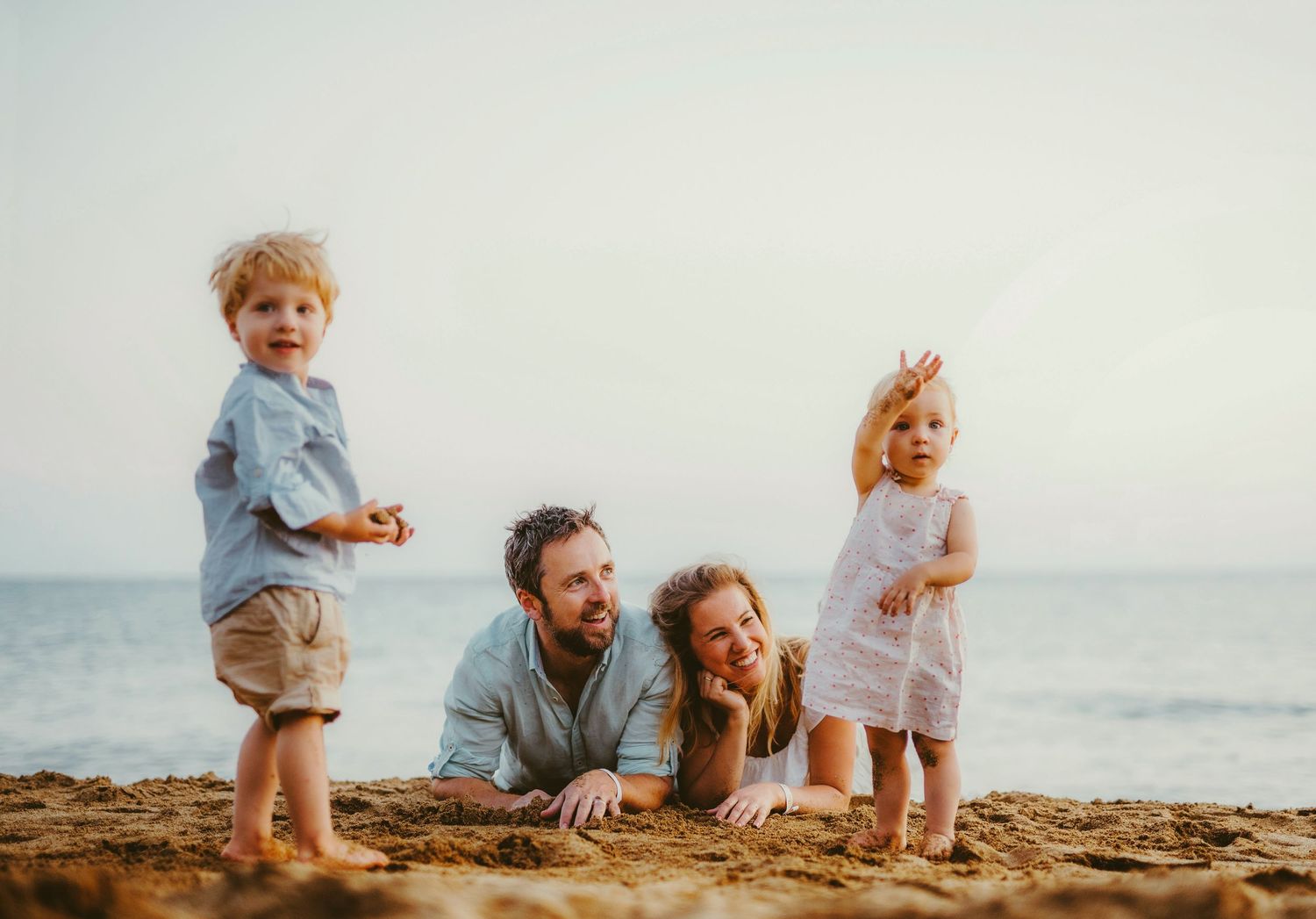 candid family photoshoot on beach with parents and young toddlers in Ottawa - R&B AuraCapture