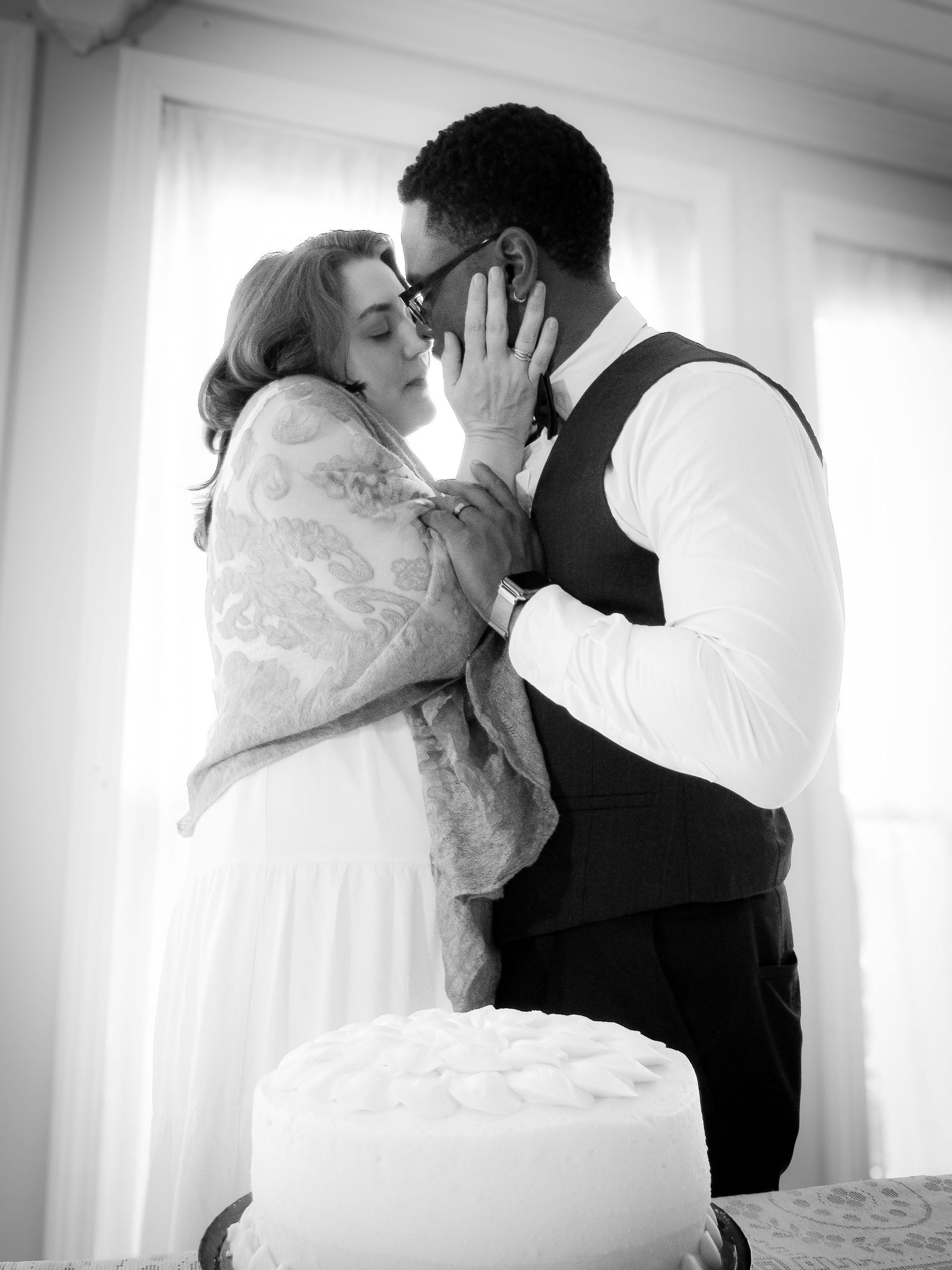 Wedding photography sequence showing romantic moments in black and white.