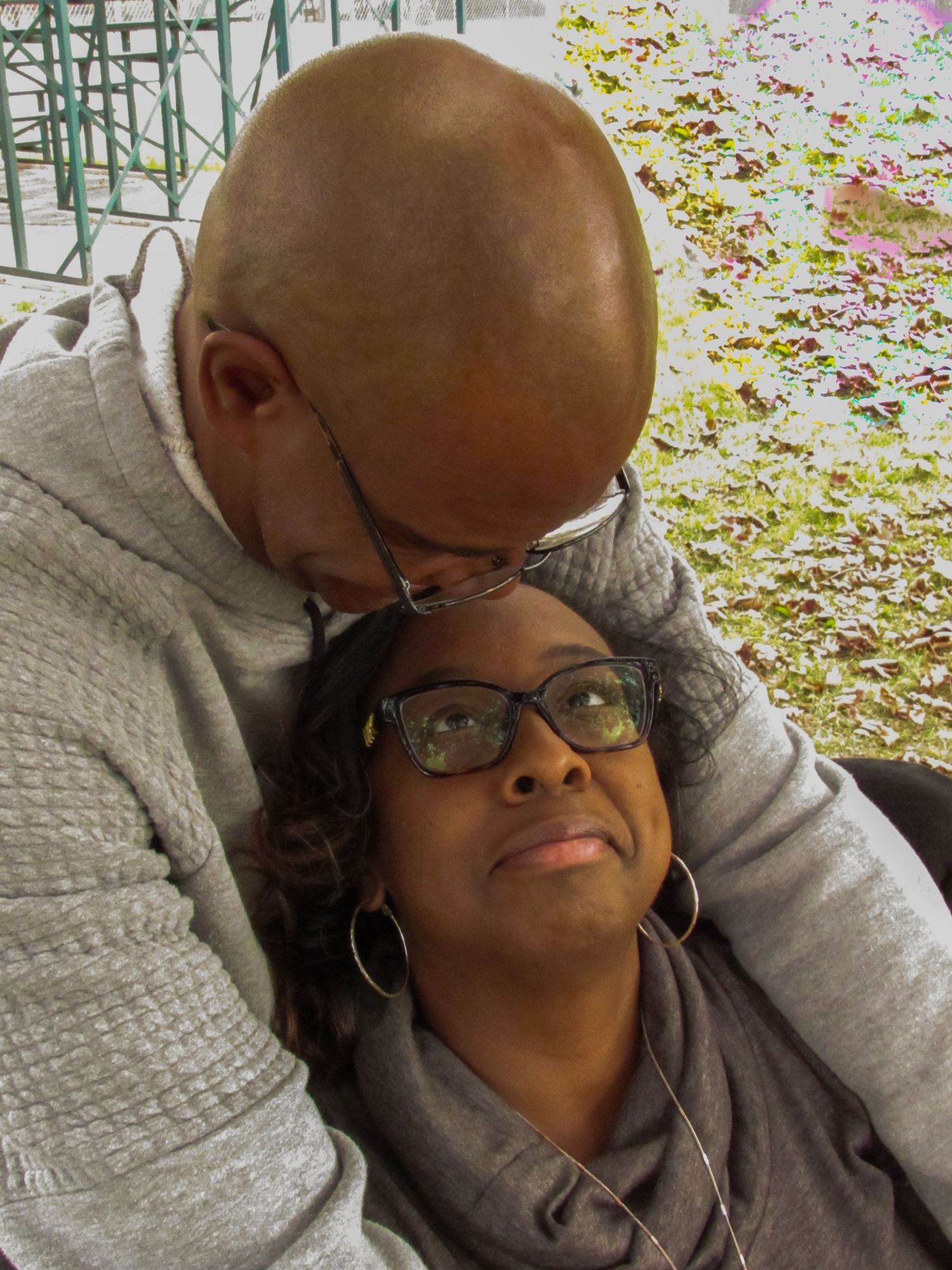 Couple sharing tender moments on a fall day.