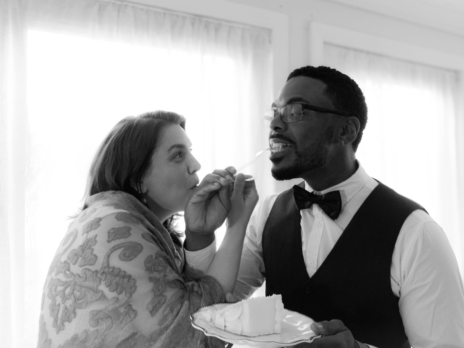 Three black and white photos show couples drinking from wine bottles in playful romantic poses.