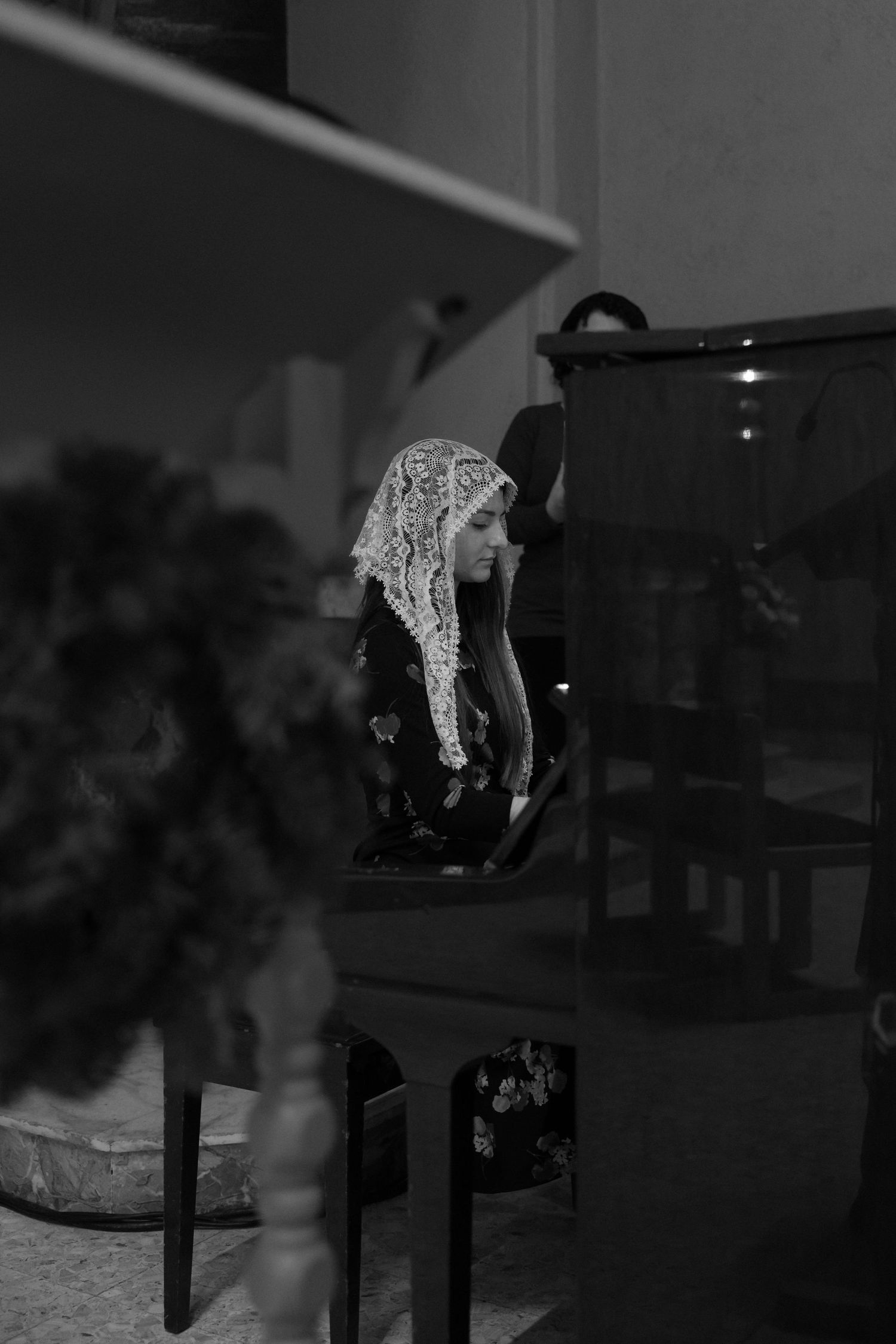 A series of black and white photographs showing details of a church interior.