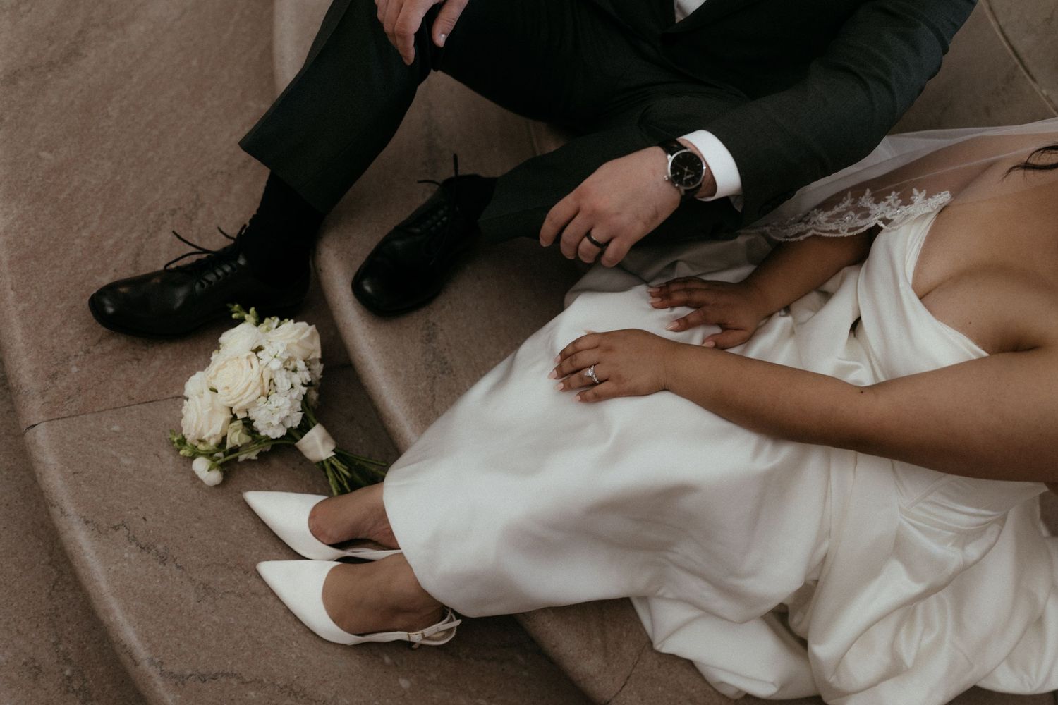 A series of wedding detail shots showing white bridal shoes, dress hem, and floral bouquet arrangements.