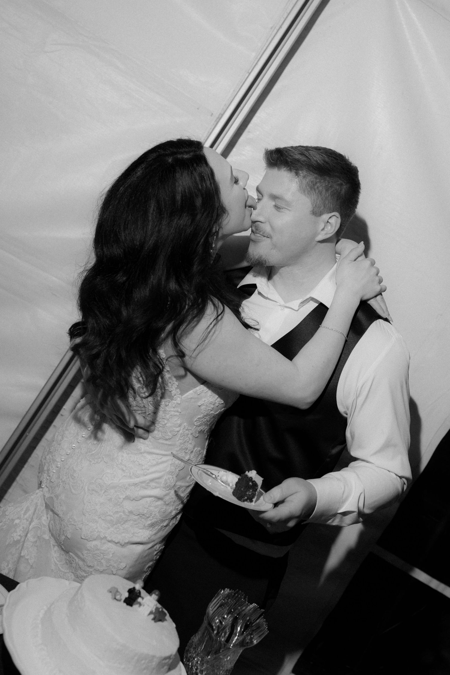 A series of candid wedding photos capturing a couple feeding each other cake in a fun and messy moment.