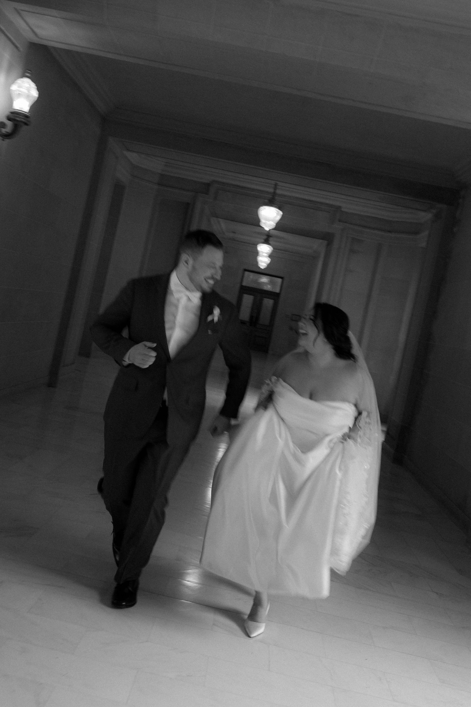 Black and white photo sequence showing a couple walking down a hallway in formal wedding attire.