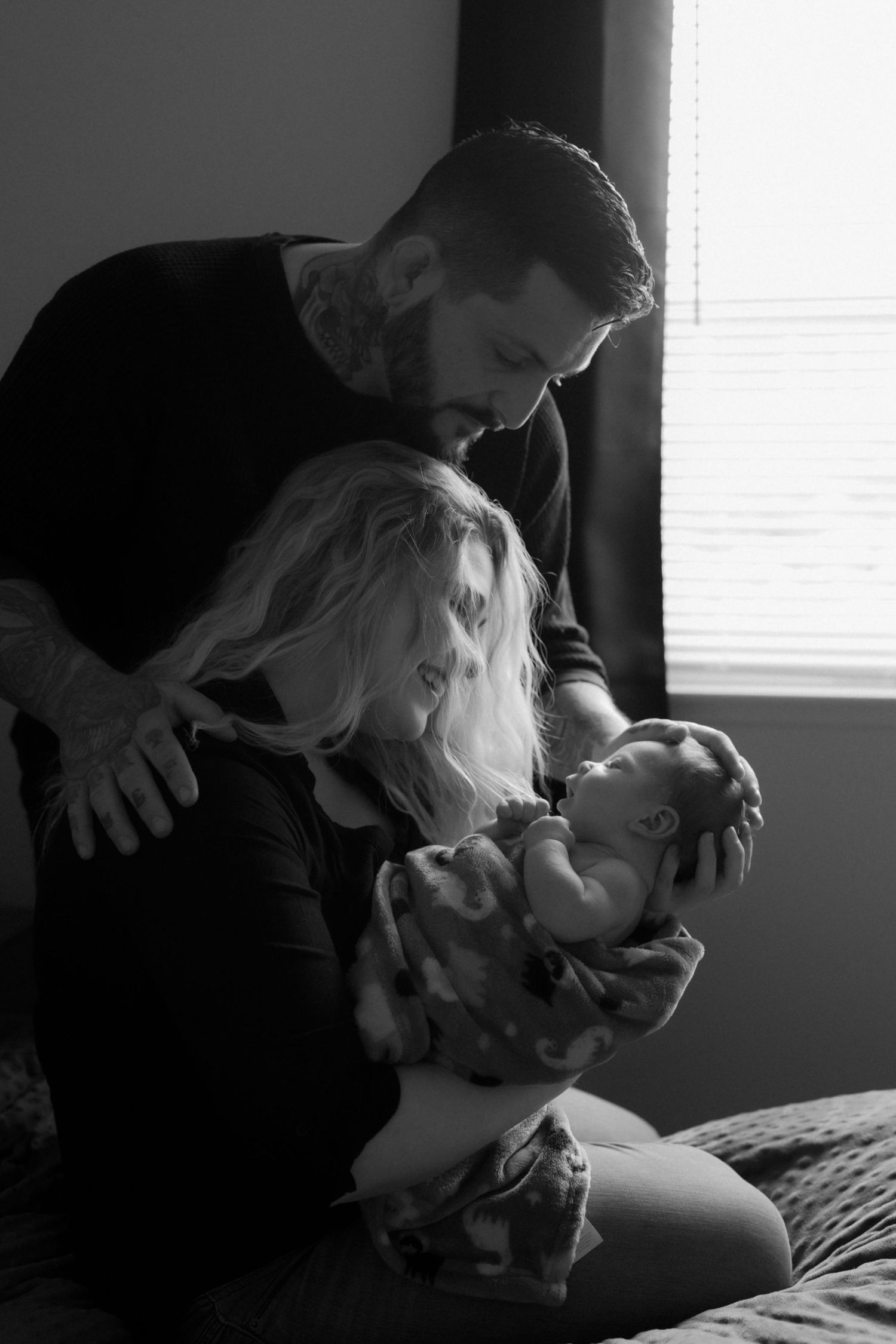 Tender black and white portrait of couple sharing intimate moment.