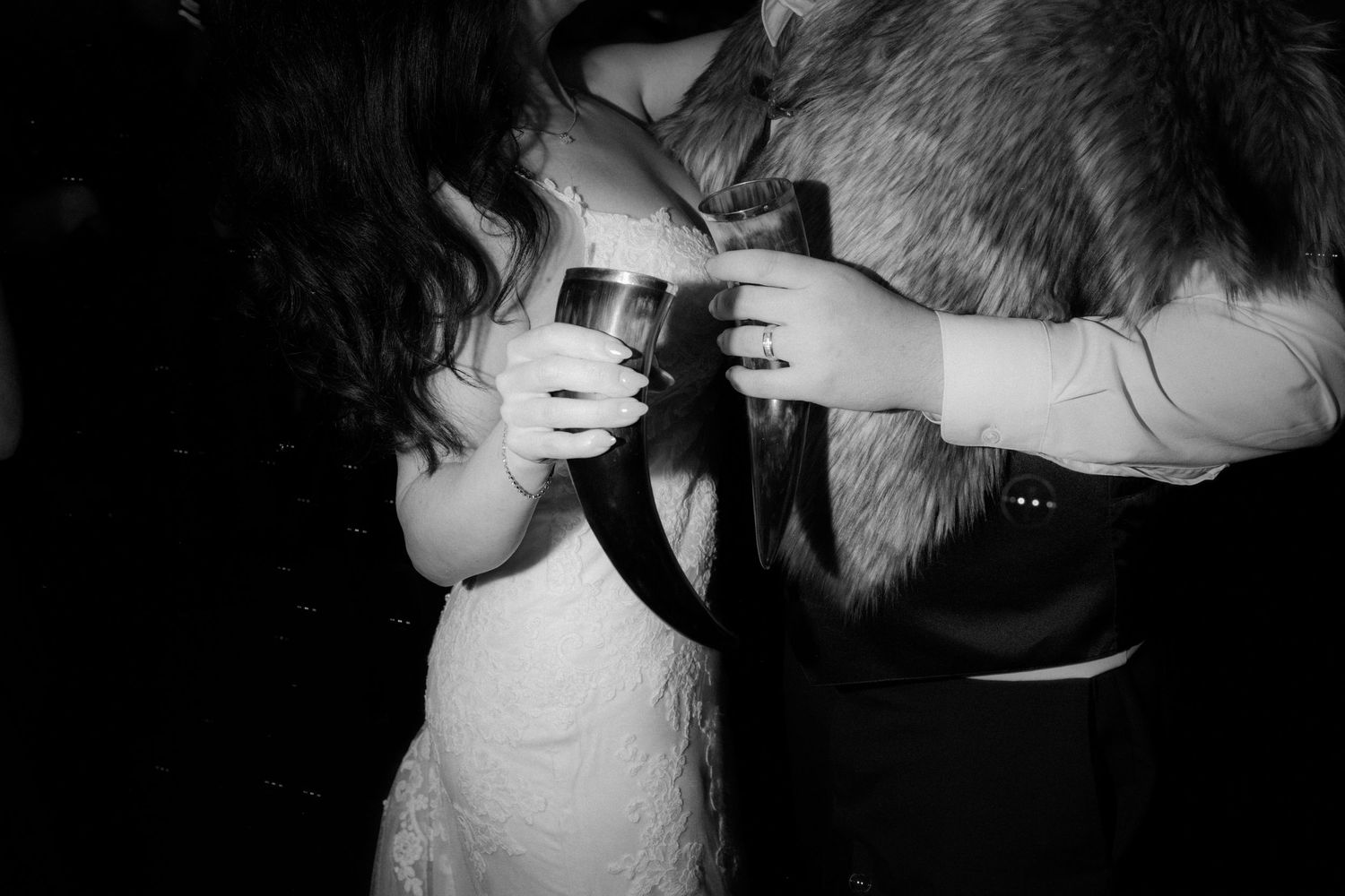 Intimate dance floor moments captured in black and white at an evening wedding celebration.