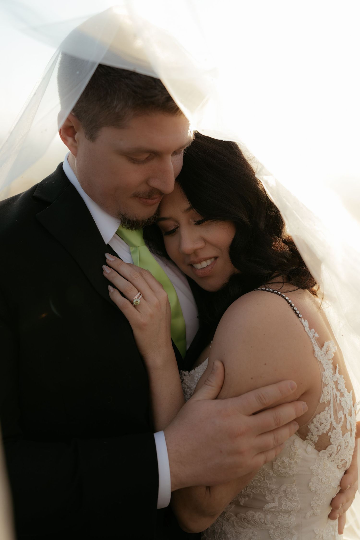 A romantic wedding moment captured in a series of intimate embraces between a couple in formal attire.