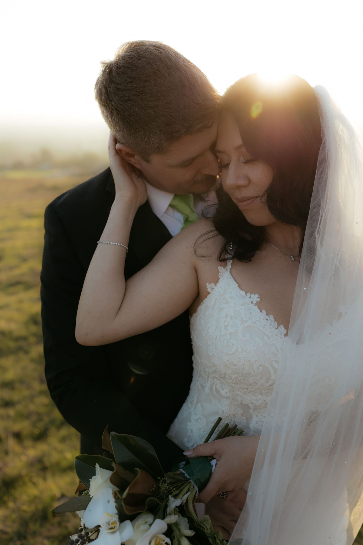 A romantic wedding photoshoot at sunset showing intimate moments between a couple in formal attire.