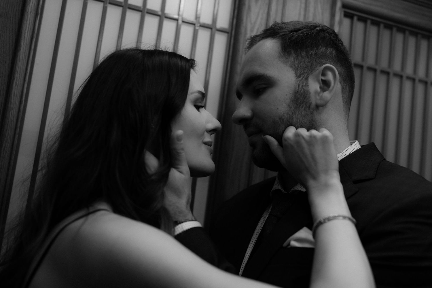 A series of black and white romantic photos showing intimate moments between a couple.