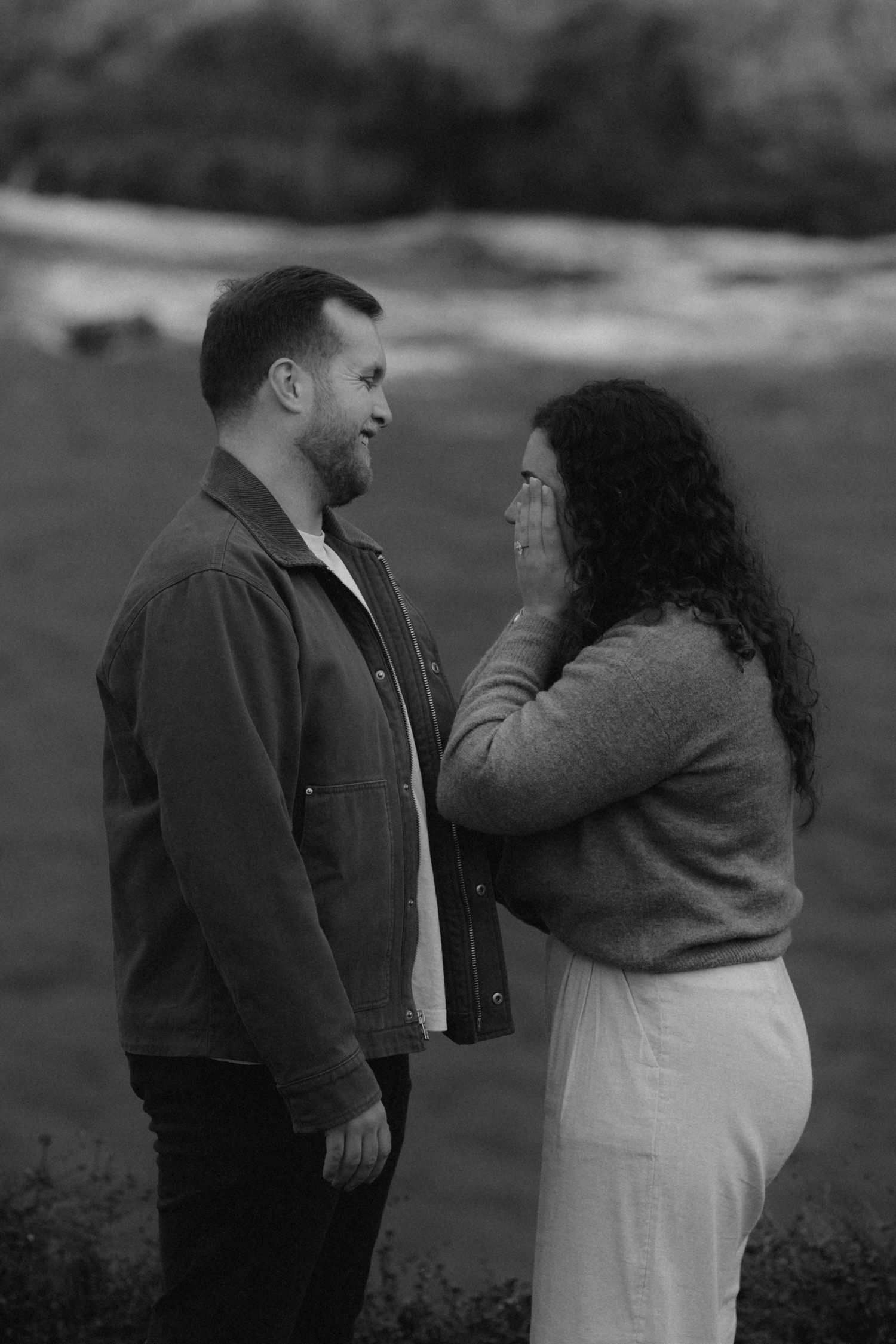 A black and white photo series showing a couple in a romantic outdoor setting, with the woman in white and man in dark clothing.
