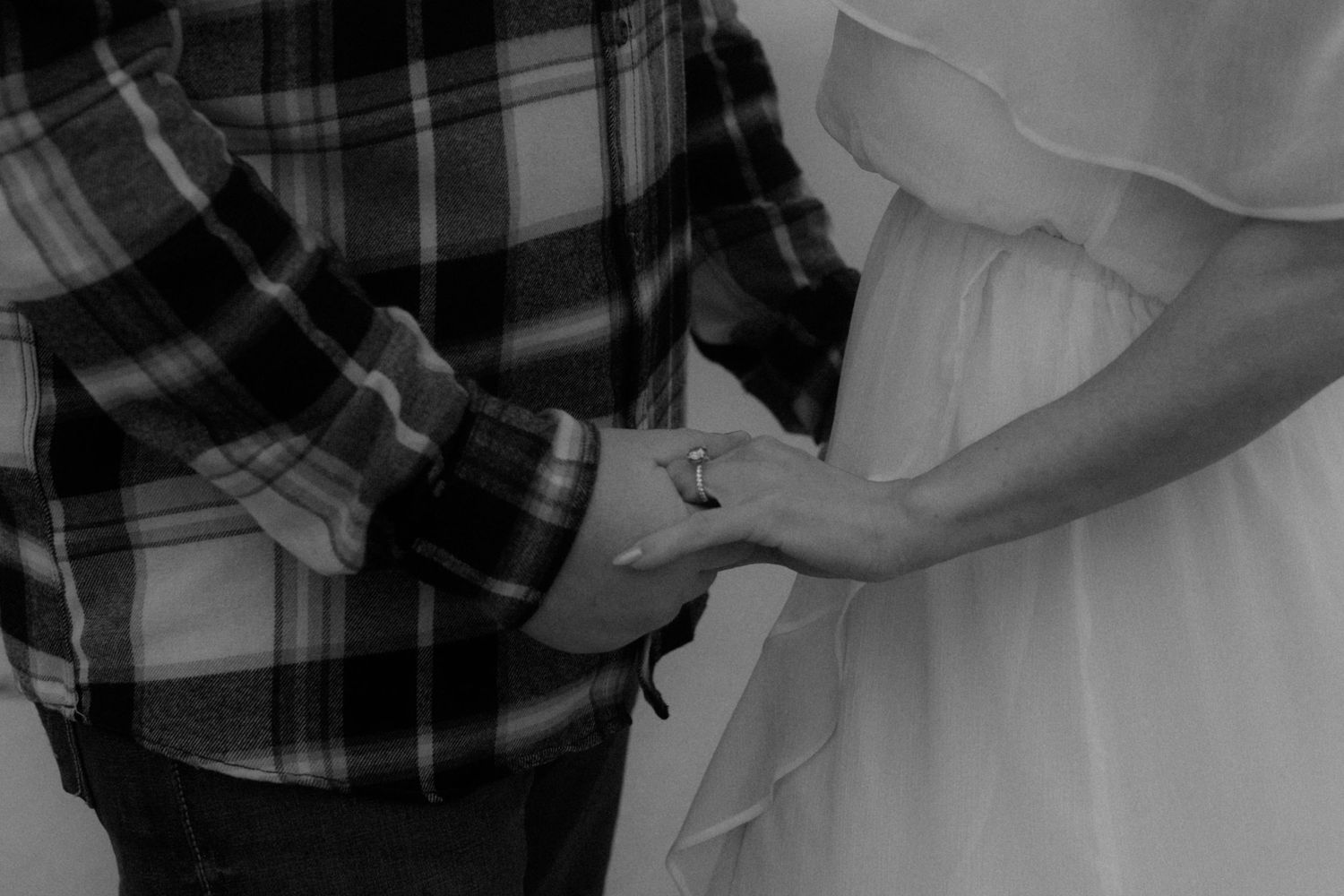 Close-up details of plaid fabric and white dress material in an artistic composition.