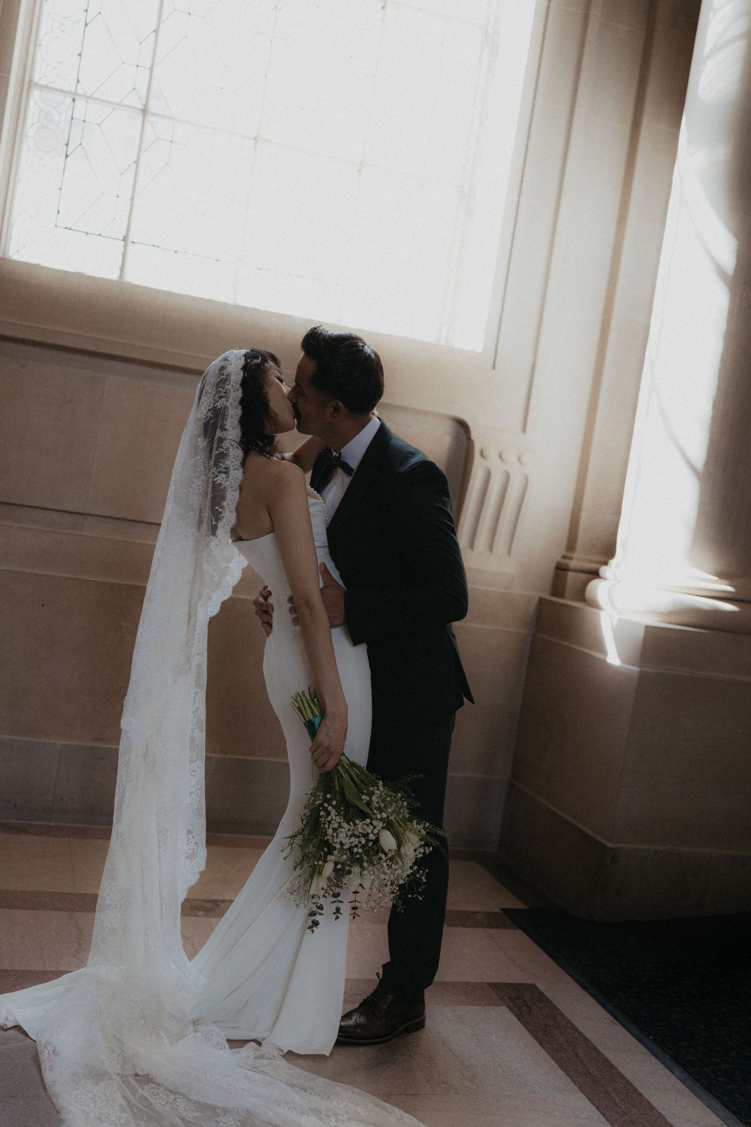 A romantic wedding sequence shows a bride and groom sharing intimate moments near a bright window.
