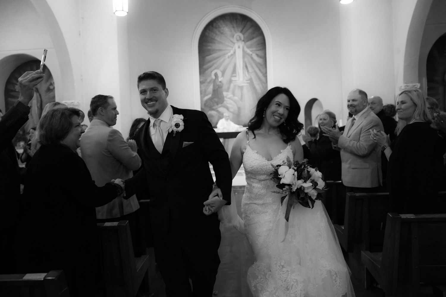 Black and white wedding photographs displayed in sequence showing reception moments and dancing at an elegant celebration.
