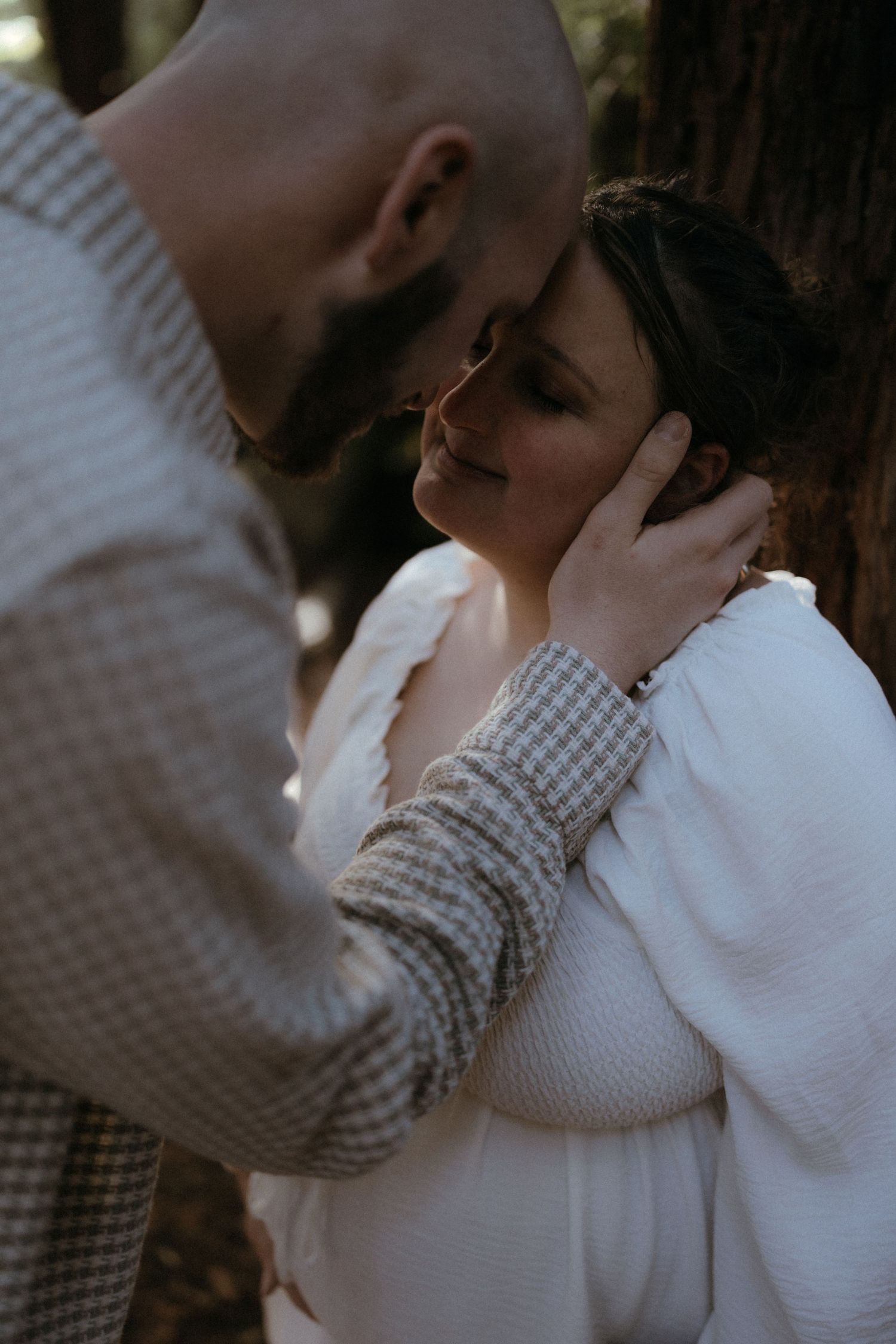 A couple embraces intimately in a romantic sequence of photos showing tender moments in soft lighting.