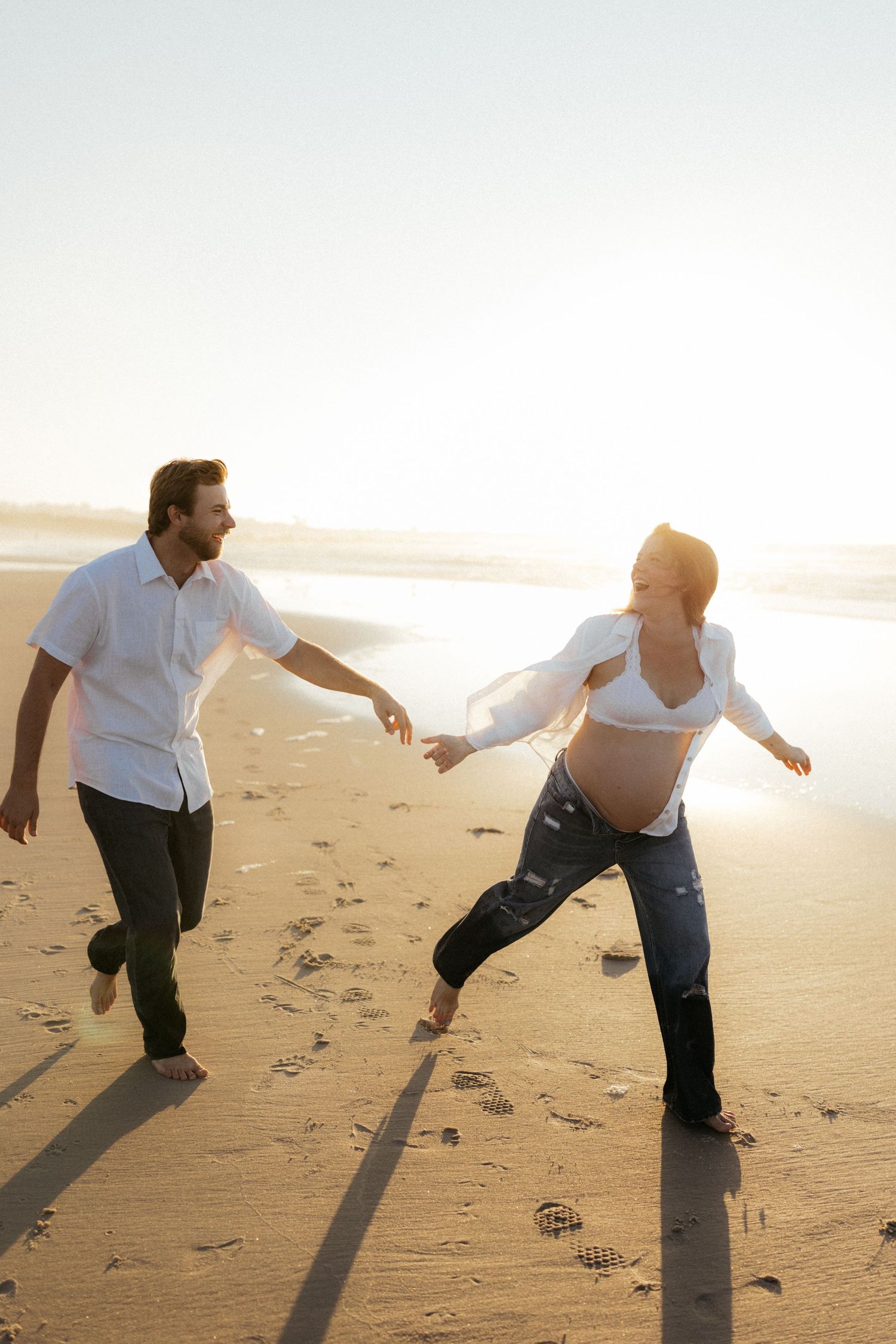 Sequence of photos showing a couple playfully dancing together on a sunlit beach at sunset.